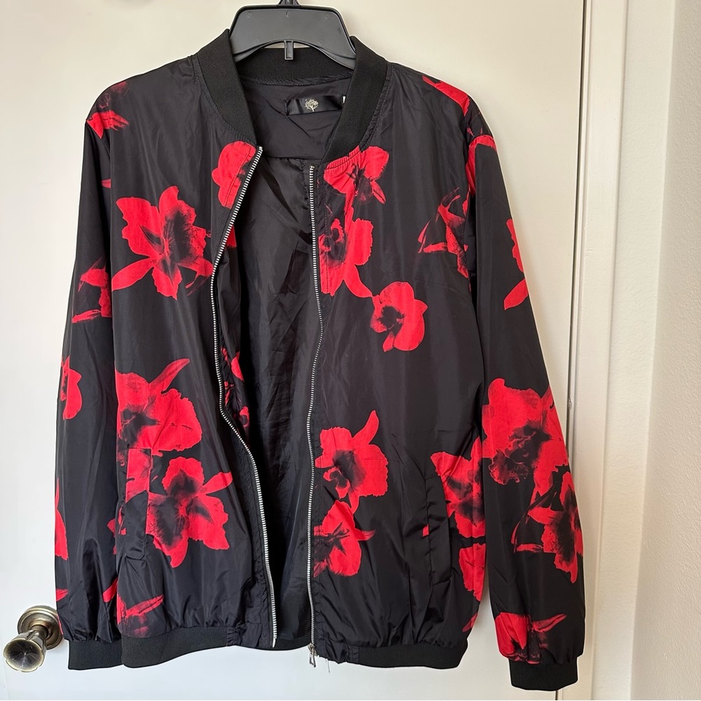 Black and red men’s zip up light weight jacket size medium